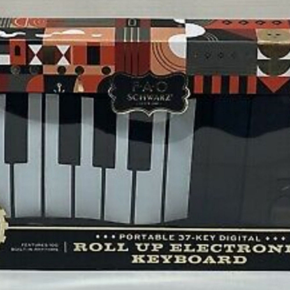 New in Box FAO SCHWARZ 37 key roll up piano